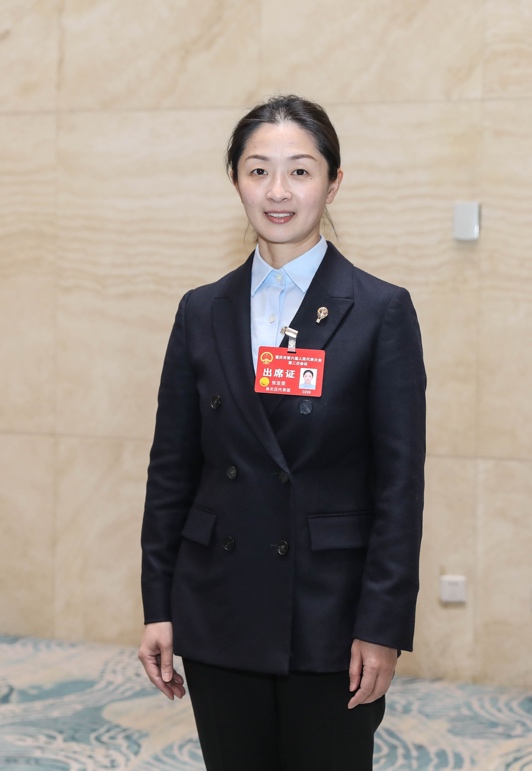 重慶市人大代表、重慶市羽毛球專業隊（渝北隊）總教練張亞雯。受訪者供圖